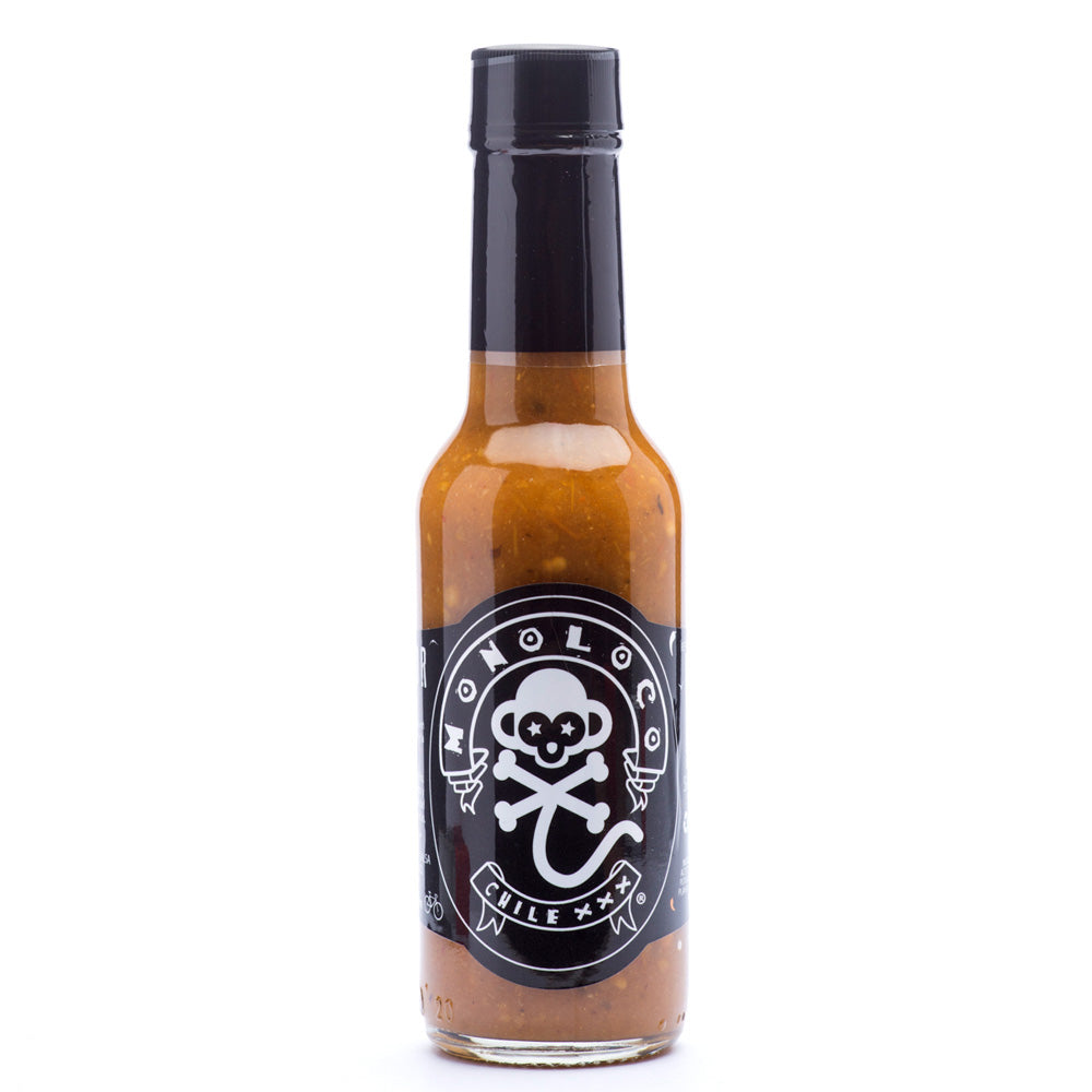 A 150ml bottle of MONOLOCO Chile XXX Hot Sauce featuring a blend of Cayenne, Yellow Peruvian, Jalapeño, Scotch Bonnet, Rocoto, and Ghost peppers, ideal for adding a medium heat and tangy flavor to culinary dishes.